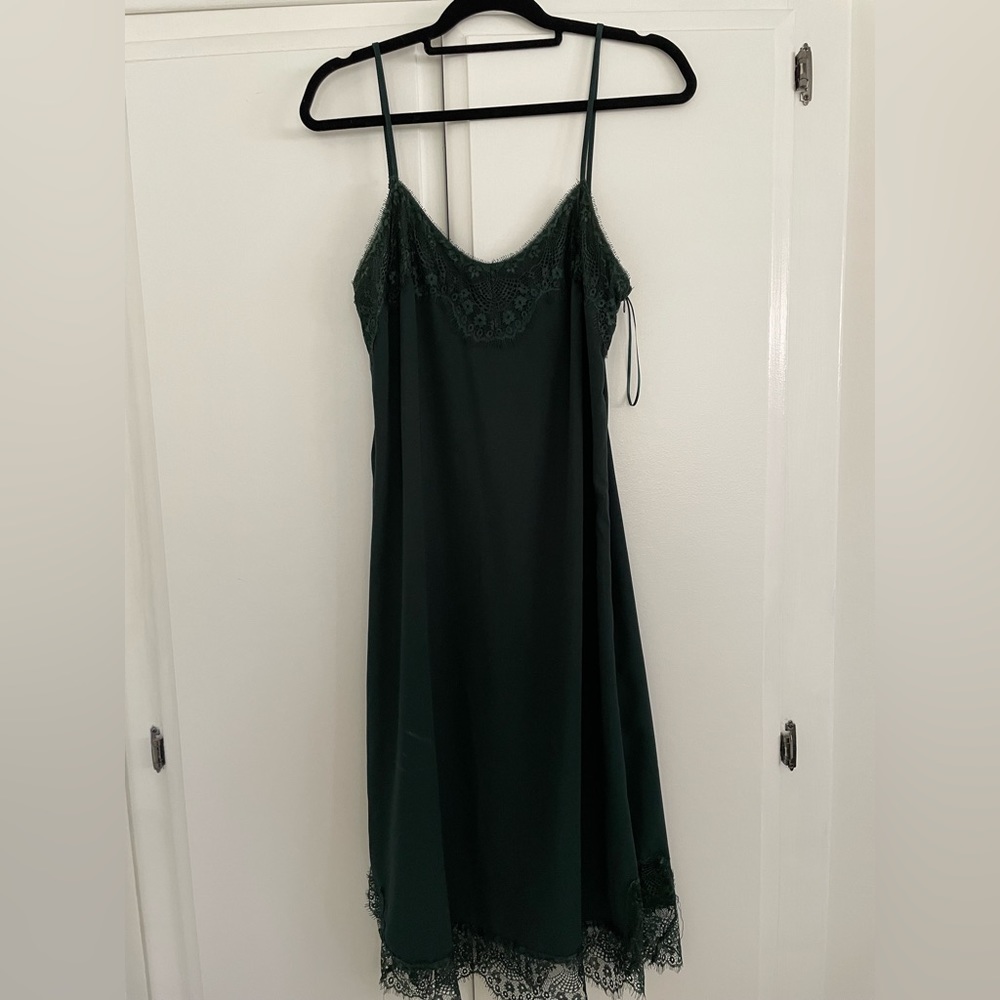 Brand new and unworn dark green laced dress. Size large